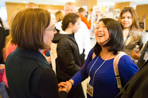 Picture of Governor Kate Brown shaking hands with a woman 